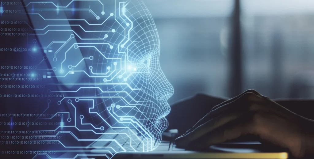 Manos-sobre-teclado-de-computadora-y-representación-de-rostro-con-IA